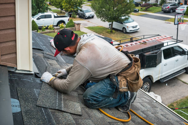 Professional Roofing technician working in Miles, IA